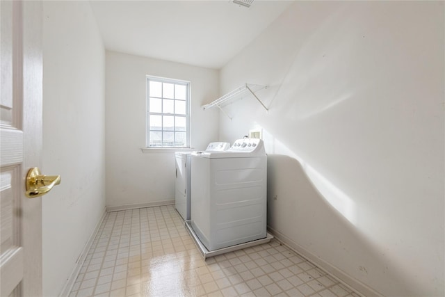 laundry room with washing machine and dryer