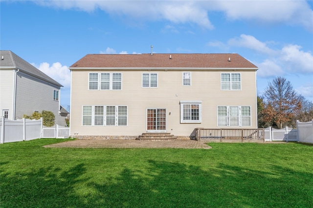 rear view of house with a lawn