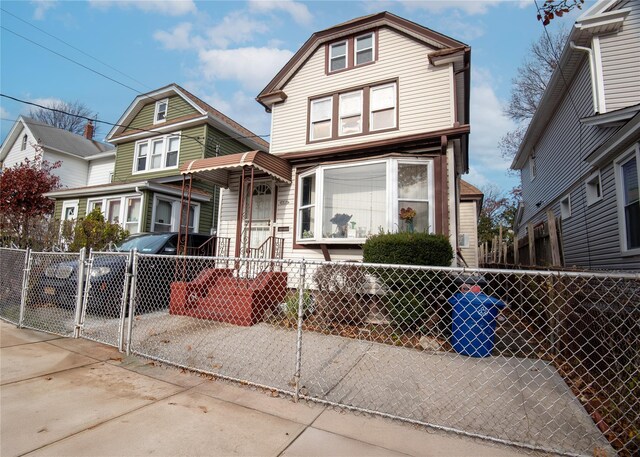 218-25 101st Ave, Queens Village, NY 11429 - view of front facade with a fenced front yard