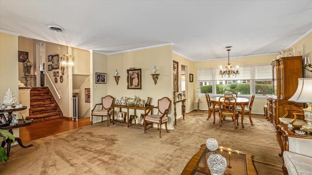 interior space featuring wood-type flooring, a notable chandelier, and ornamental molding