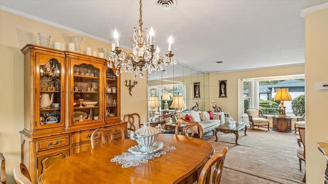 carpeted dining room featuring ornamental molding and a notable chandelier