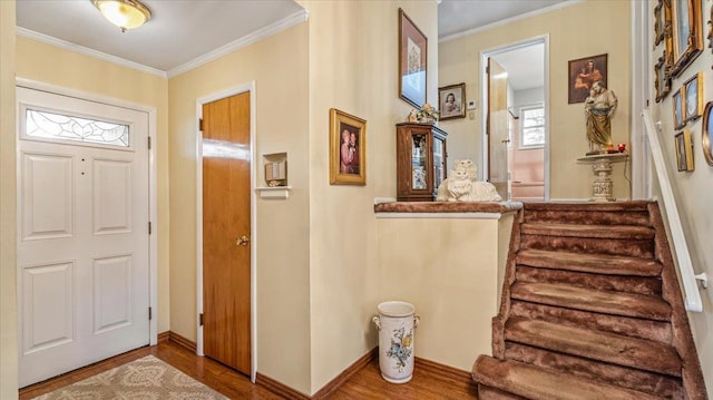 entrance foyer featuring hardwood / wood-style floors and ornamental molding