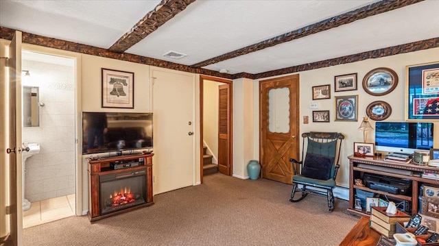 interior space featuring carpet flooring and beamed ceiling