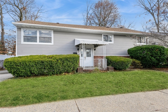 bi-level home with a front yard