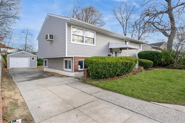 view of front of home featuring a front yard, an AC wall unit, a garage, and an outdoor structure