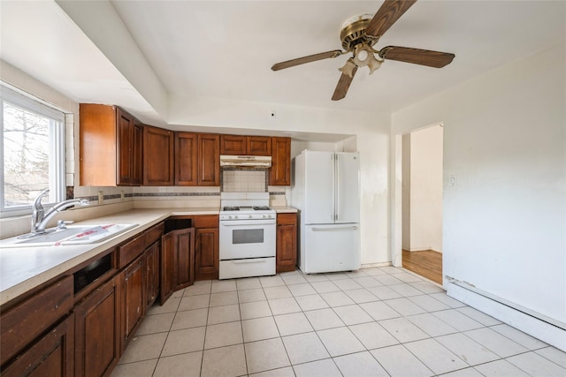 kitchen with ceiling fan, sink, white appliances, decorative backsplash, and light tile patterned flooring