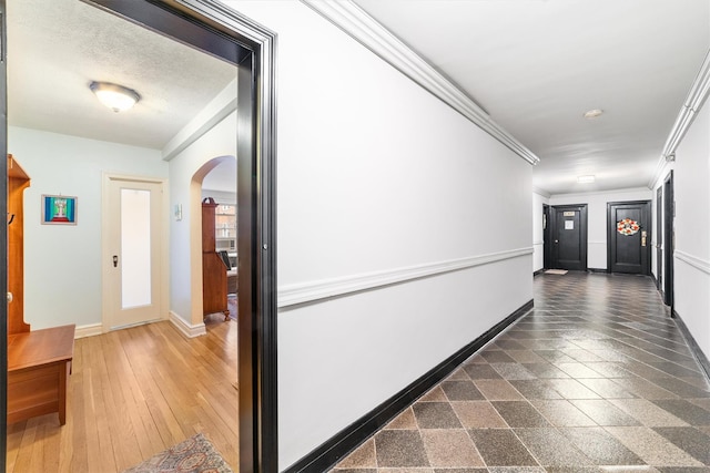 hall featuring dark hardwood / wood-style flooring and ornamental molding