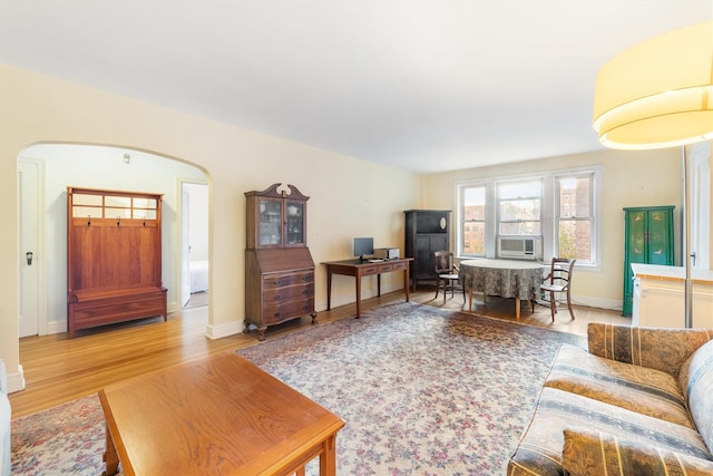 living room with hardwood / wood-style flooring and cooling unit