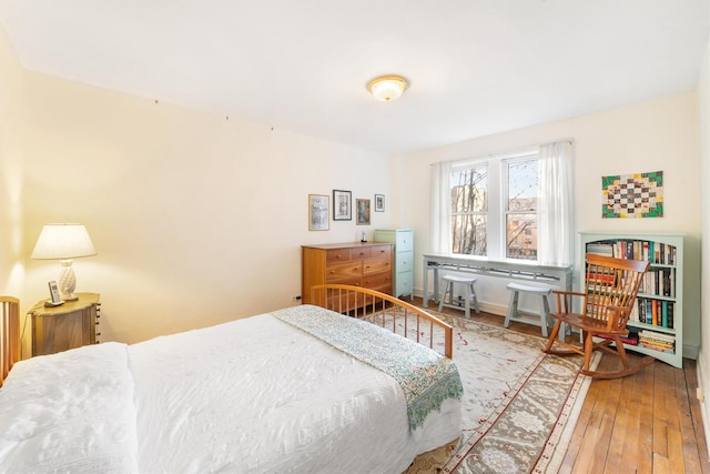 bedroom featuring wood-type flooring