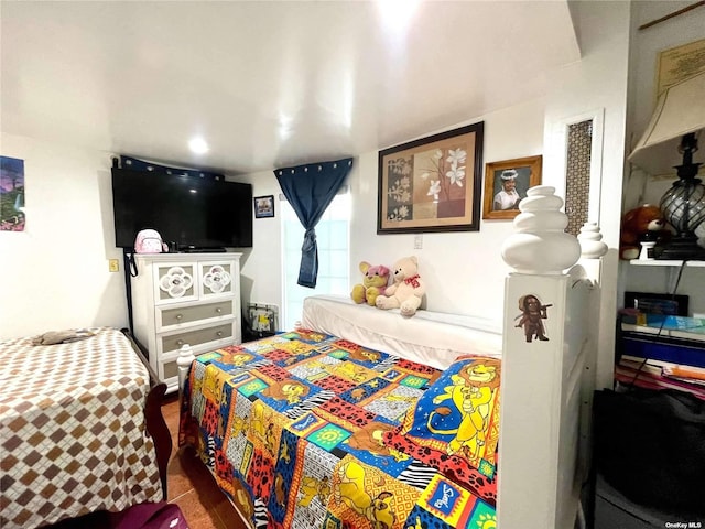 bedroom with dark tile patterned floors