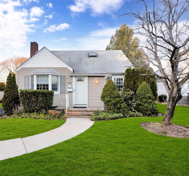 view of front of home featuring a front lawn