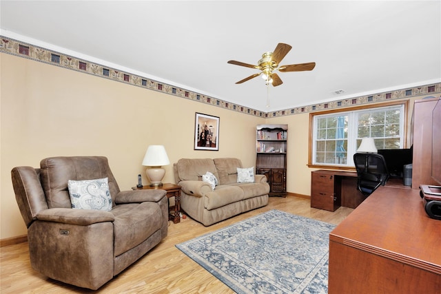 home office with ceiling fan and light hardwood / wood-style floors