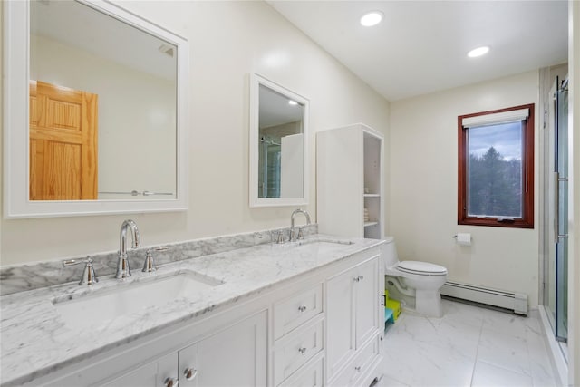 bathroom featuring vanity, a baseboard radiator, and toilet