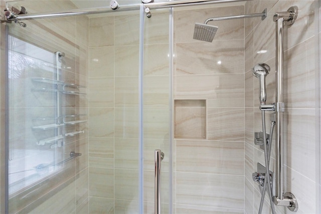 bathroom with a shower with shower door