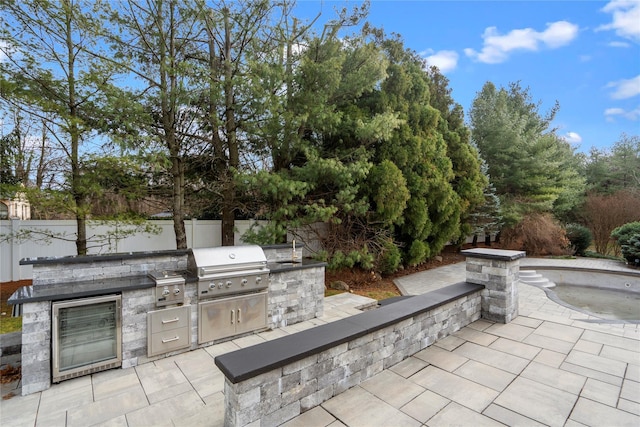 view of patio featuring grilling area and an outdoor kitchen