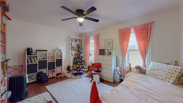 bedroom featuring ceiling fan and dark hardwood / wood-style flooring