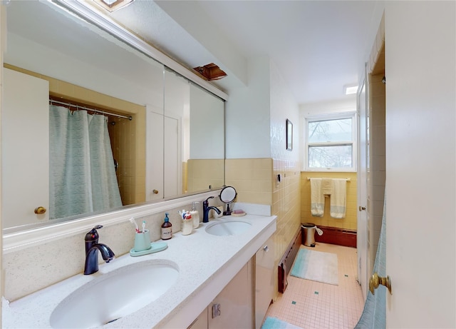 4 Elizabeth St, Port Jervis, NY 12771 - full bath featuring double vanity, tile patterned flooring, and tile walls