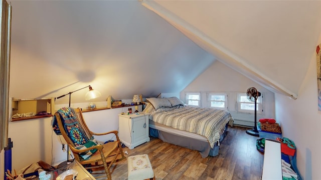 bedroom featuring wood-type flooring, vaulted ceiling, and baseboard heating