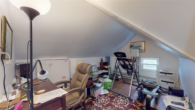 office area featuring hardwood / wood-style floors and vaulted ceiling