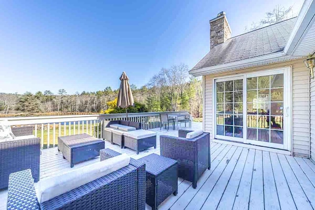 wooden terrace featuring outdoor lounge area