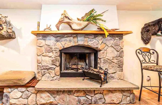 details with a fireplace and hardwood / wood-style floors