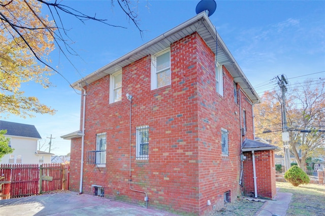 view of side of property with a patio