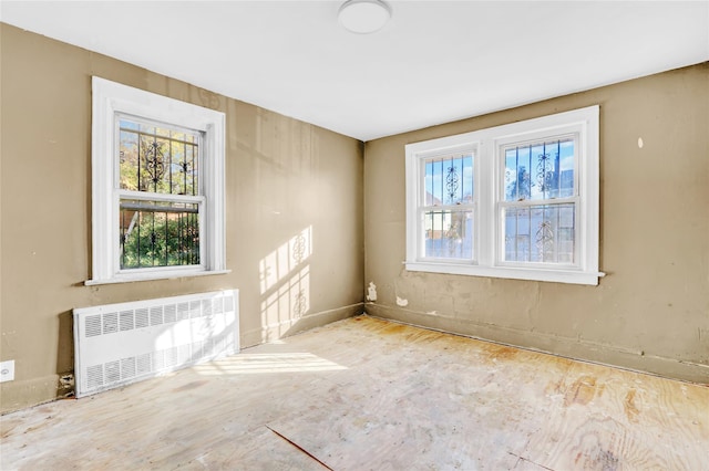 spare room with radiator heating unit