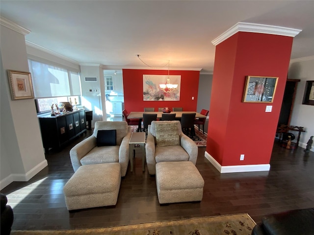 living room with dark hardwood / wood-style flooring, an inviting chandelier, and ornamental molding