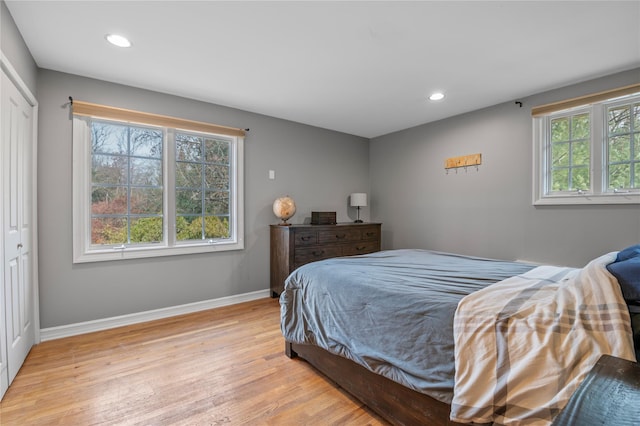 bedroom featuring a closet and light hardwood / wood-style floors