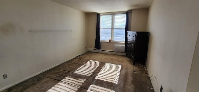 carpeted empty room with baseboard heating