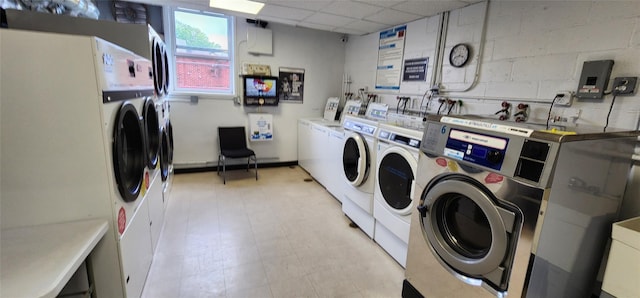 clothes washing area featuring separate washer and dryer