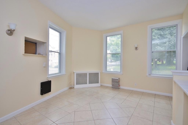 spare room with light tile patterned floors