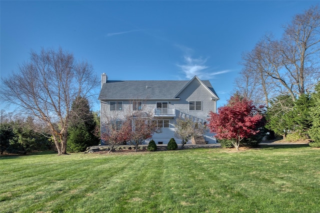 back of house with a yard