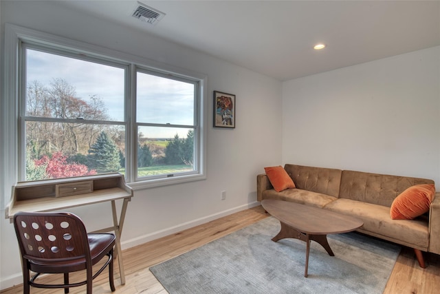 living room with light hardwood / wood-style floors