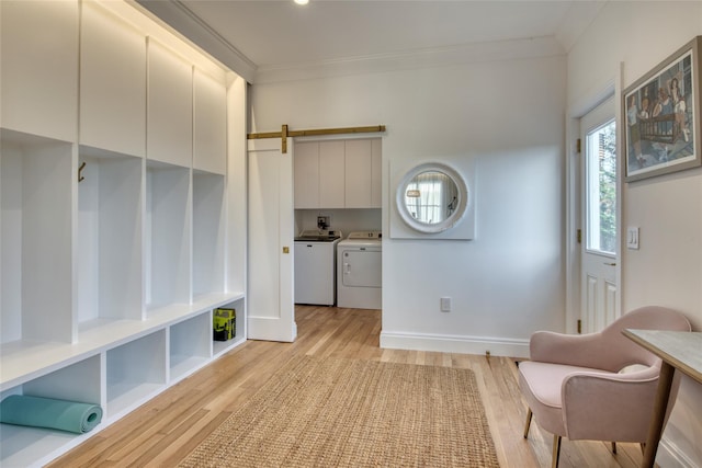 465 Sound Shore Rd, Aquebogue, NY 11901 - sitting room with washing machine and dryer, crown molding, and light wood finished floors