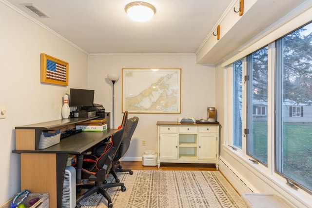 office with crown molding and light hardwood / wood-style flooring