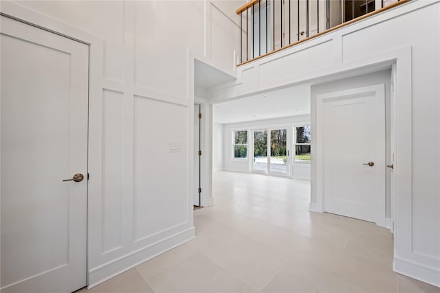 hallway with light tile patterned floors