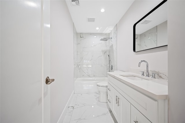 full bathroom featuring toilet, vanity, and tiled shower / bath