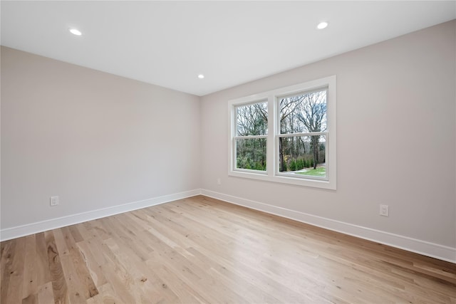 spare room featuring light hardwood / wood-style floors