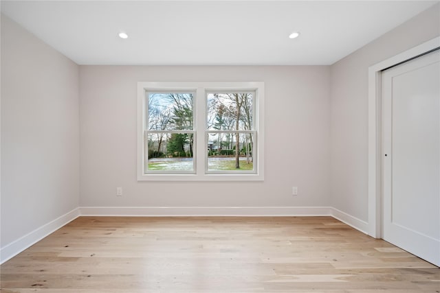 spare room featuring light hardwood / wood-style floors