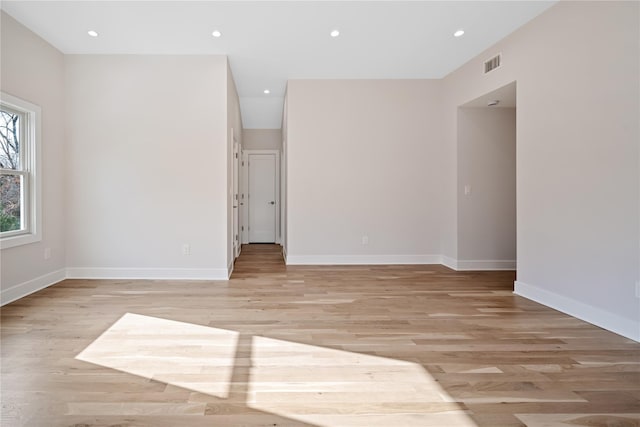 unfurnished room with light hardwood / wood-style flooring