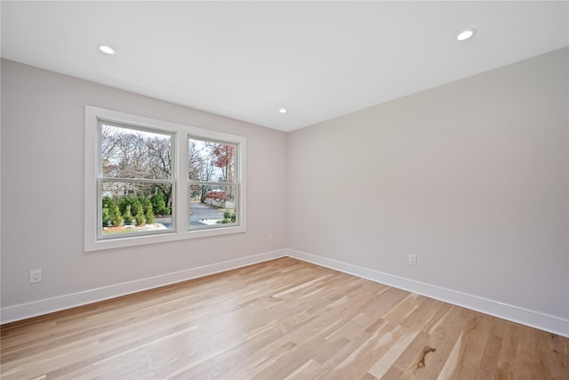 empty room with light hardwood / wood-style floors