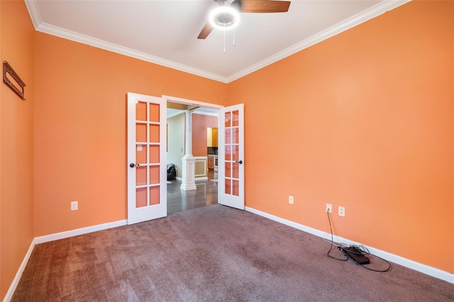 carpeted empty room featuring french doors, ceiling fan, and crown molding