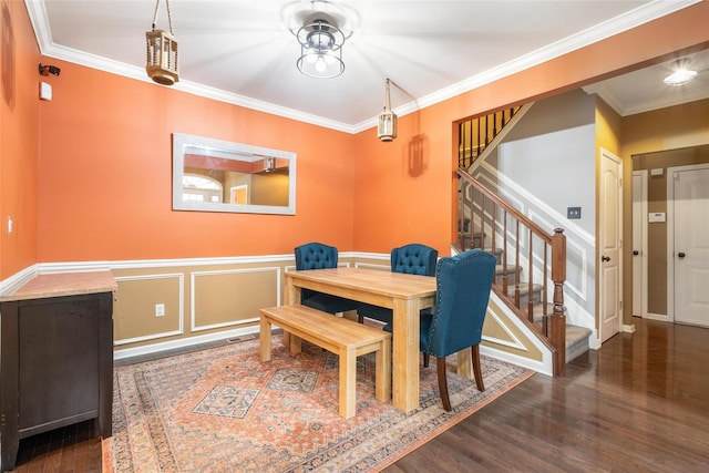 dining space with crown molding and dark wood-type flooring