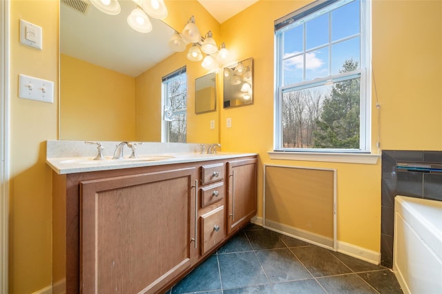 bathroom with tile patterned flooring and vanity