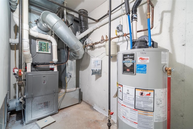 utility room featuring water heater