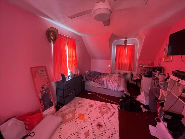 carpeted bedroom with ceiling fan and lofted ceiling