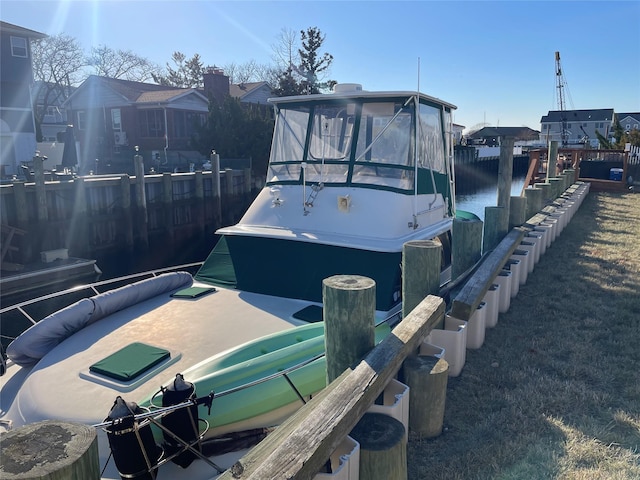 exterior space with a boat dock and a water view