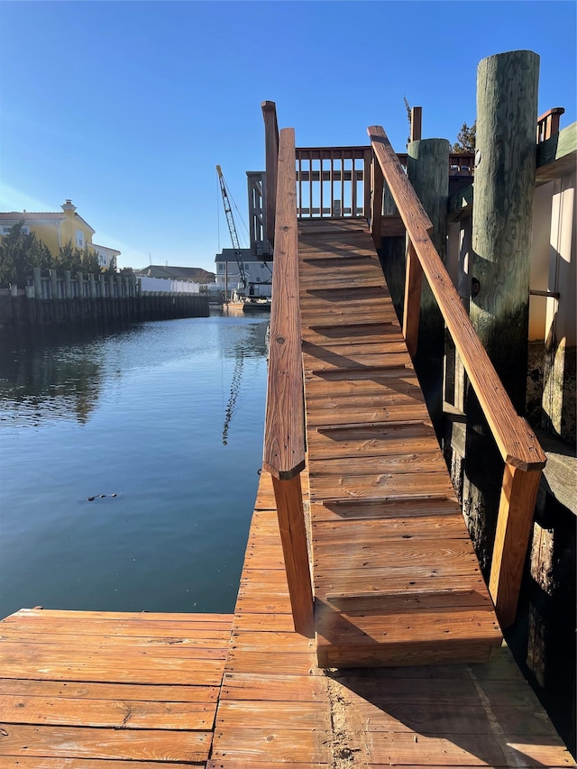 dock area with a water view