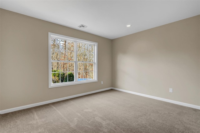 unfurnished room featuring carpet flooring